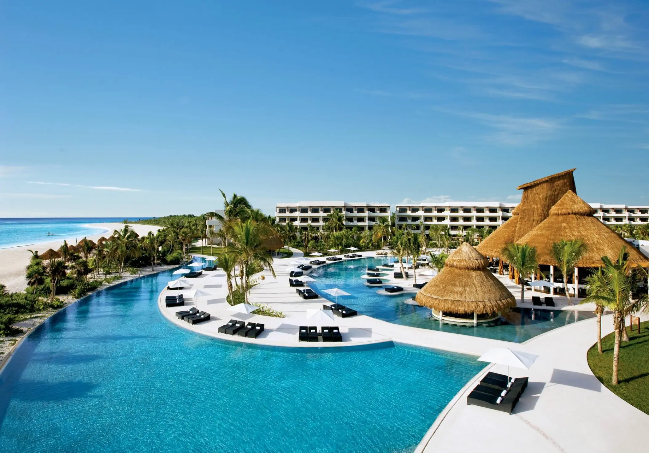 Aerial view of the swimming pools and beachfront at Secrets Maroma Beach, Riviera Maya