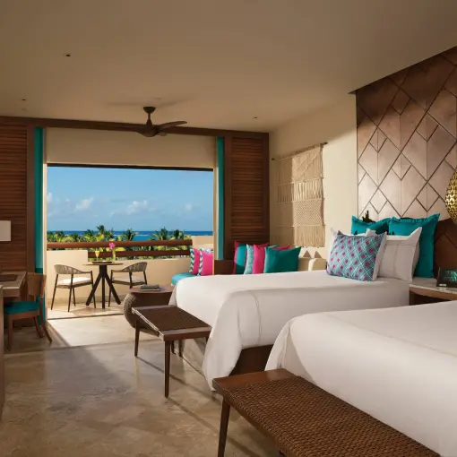 Junior suite with two beds and an ocean-view terrace at Secrets Maroma Beach, Riviera Maya