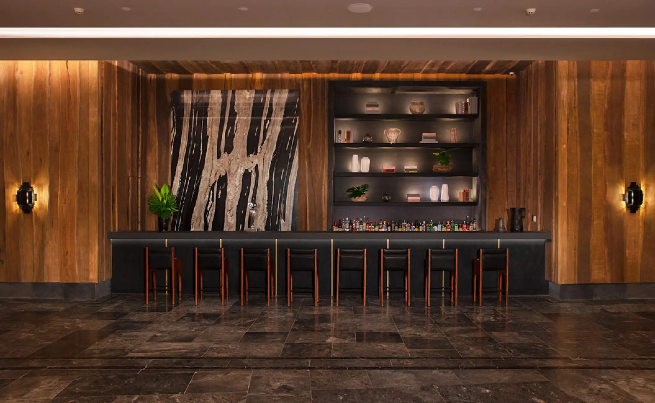 Modern wood-paneled cocktail bar with black seating at Secrets Moxche, Playa Del Carmen