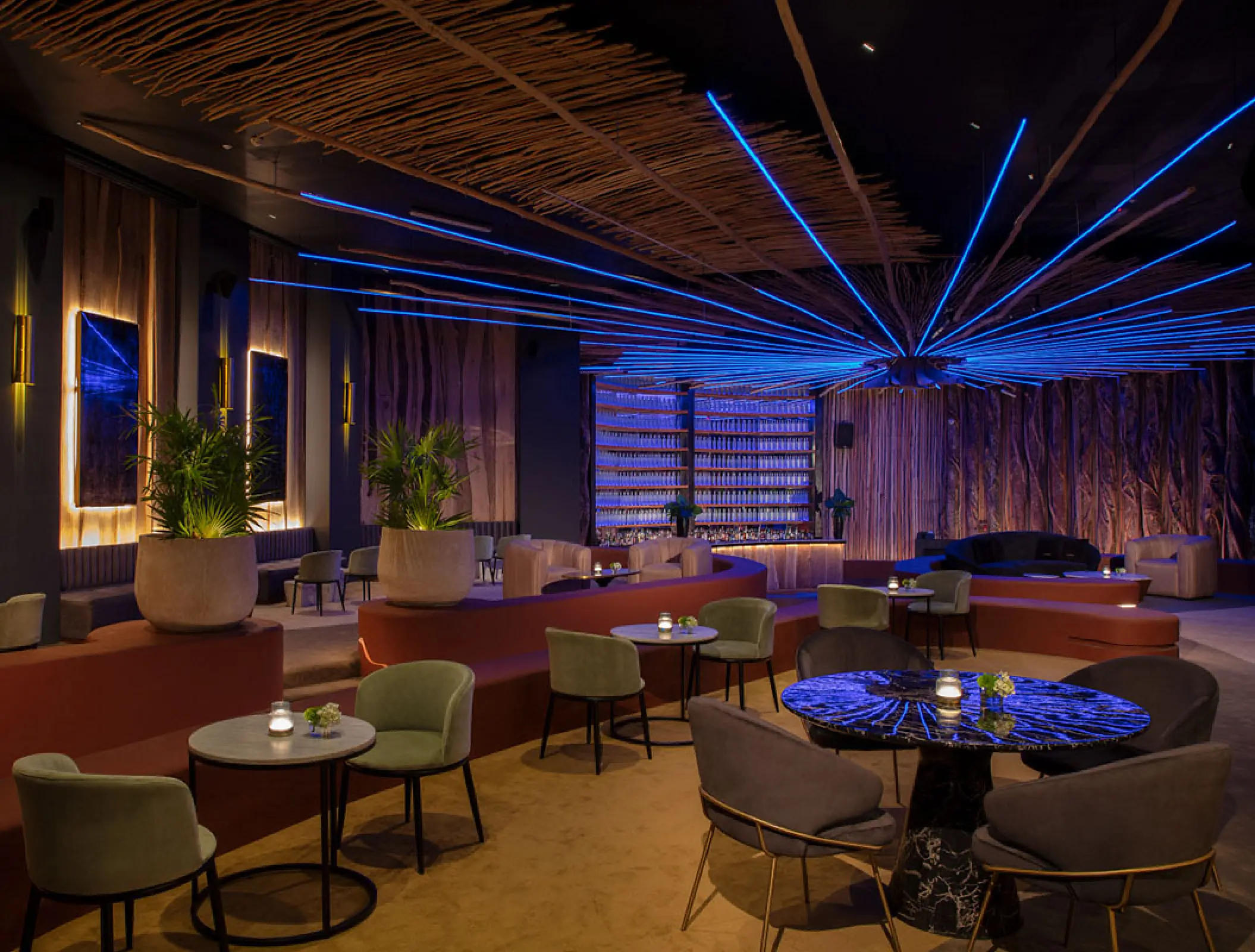 Gypsy Club lounge with blue neon ceiling lights at Secrets Moxche, Playa Del Carmen