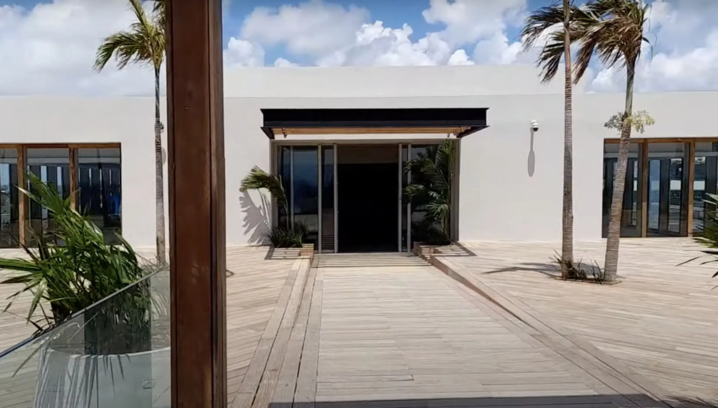 Sky Wedding Salon terrace with palm trees and modern architecture at Impression Moxché by Secrets, Playa Del Carmen