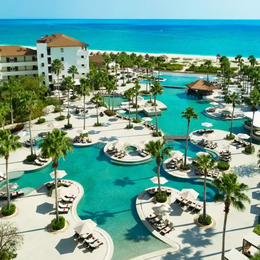 Secrets Playa Mujeres main pool and grounds overlooking the turquoise Caribbean Sea, Cancun