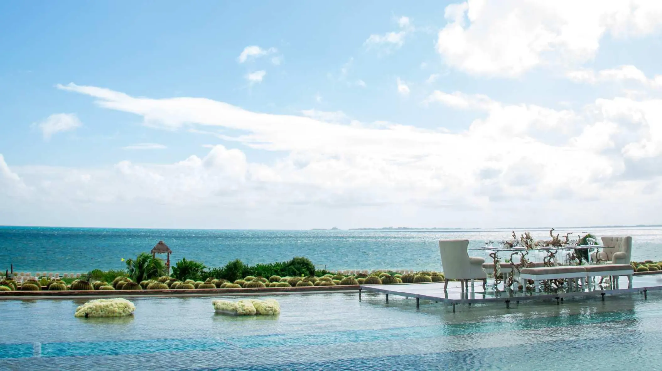 Over-water wedding reception platform on the infinity pool at Secrets Playa Mujeres, Cancun