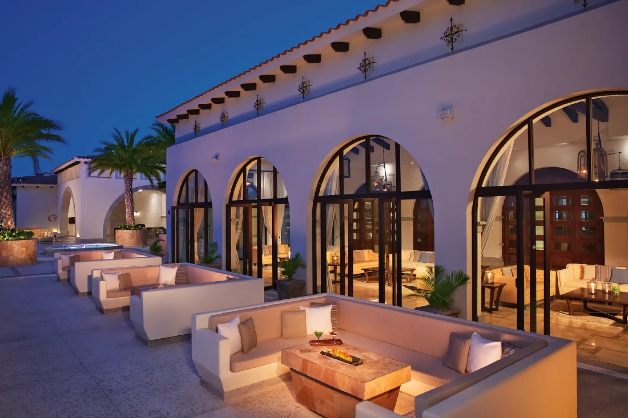 Bar Rendezvous terrace with outdoor lounge seating at Secrets Puerto Los Cabos, Cabo San Lucas