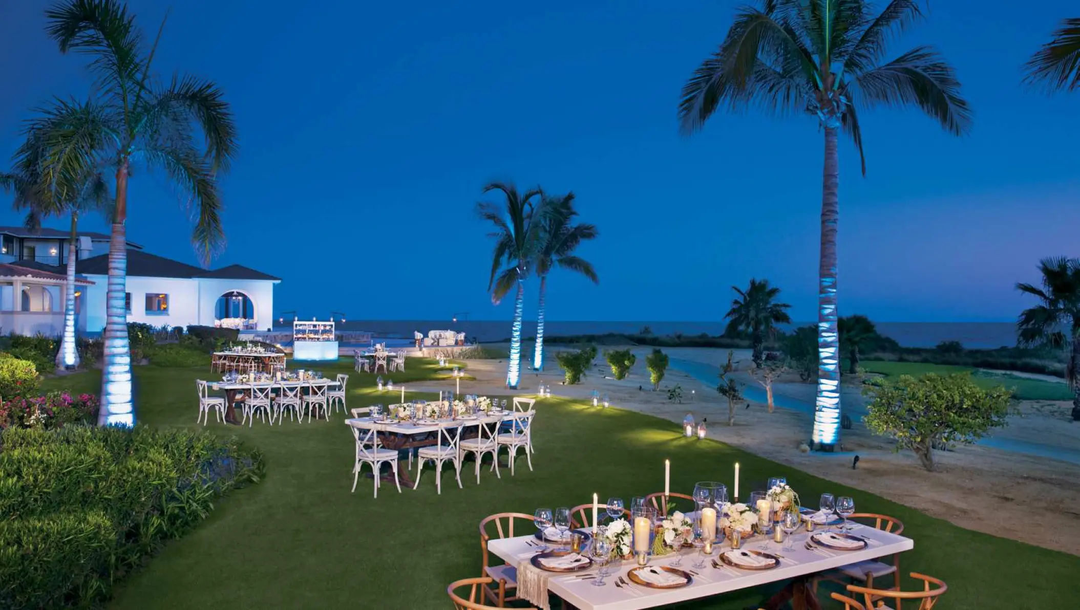 Evening wedding reception on the Oceana Garden lawn at Secrets Puerto Los Cabos, Cabo San Lucas