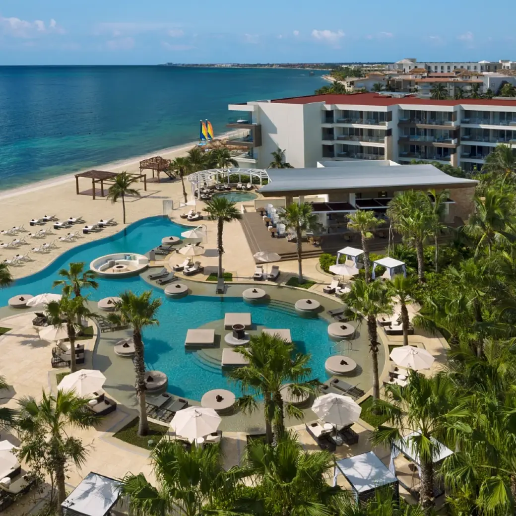 Aerial view of beachfront pools and grounds at Secrets Riviera Cancun, Riviera Maya