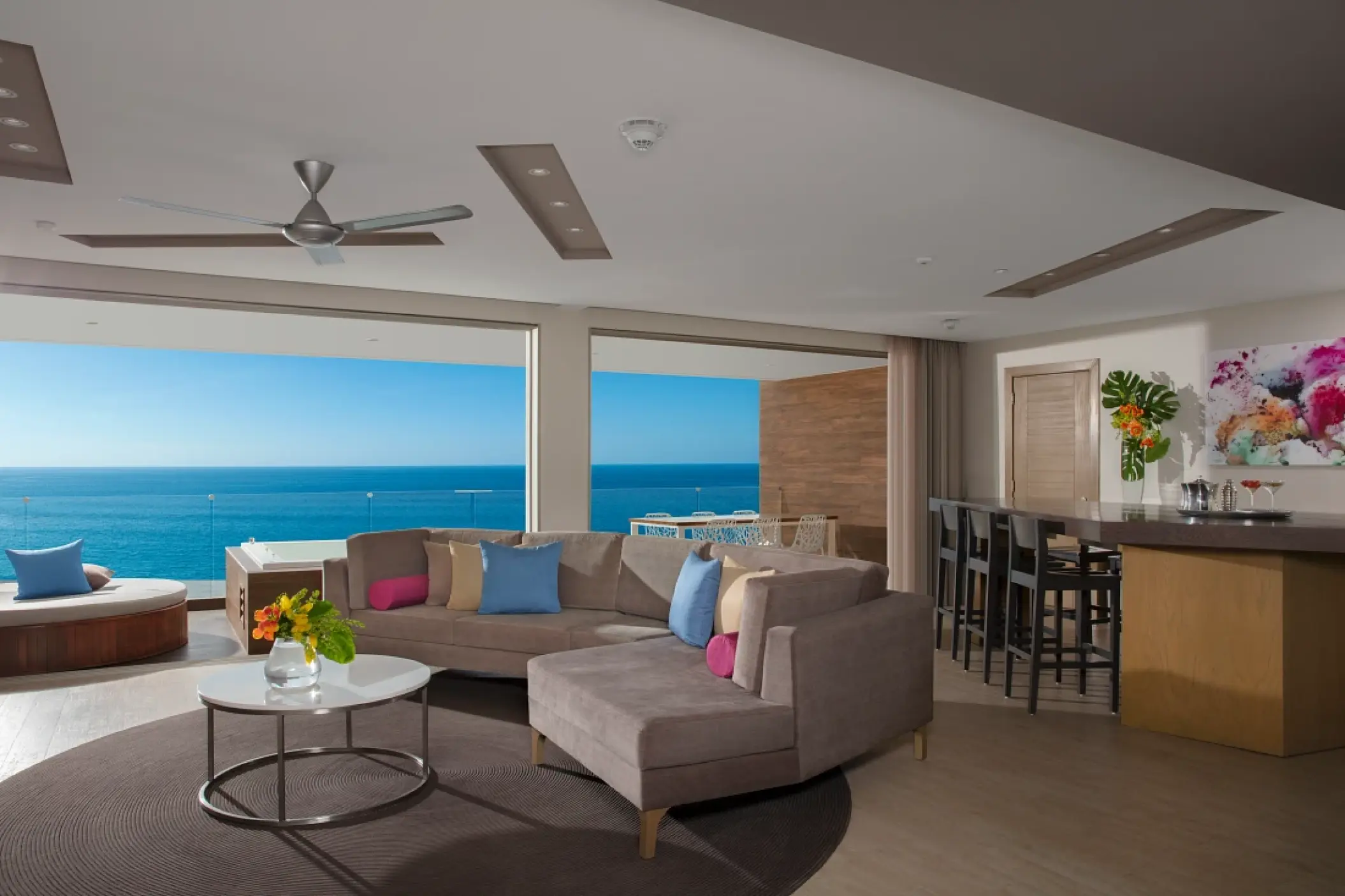 Modern suite living room and private balcony overlooking the ocean at Secrets Riviera Cancun, Riviera Maya