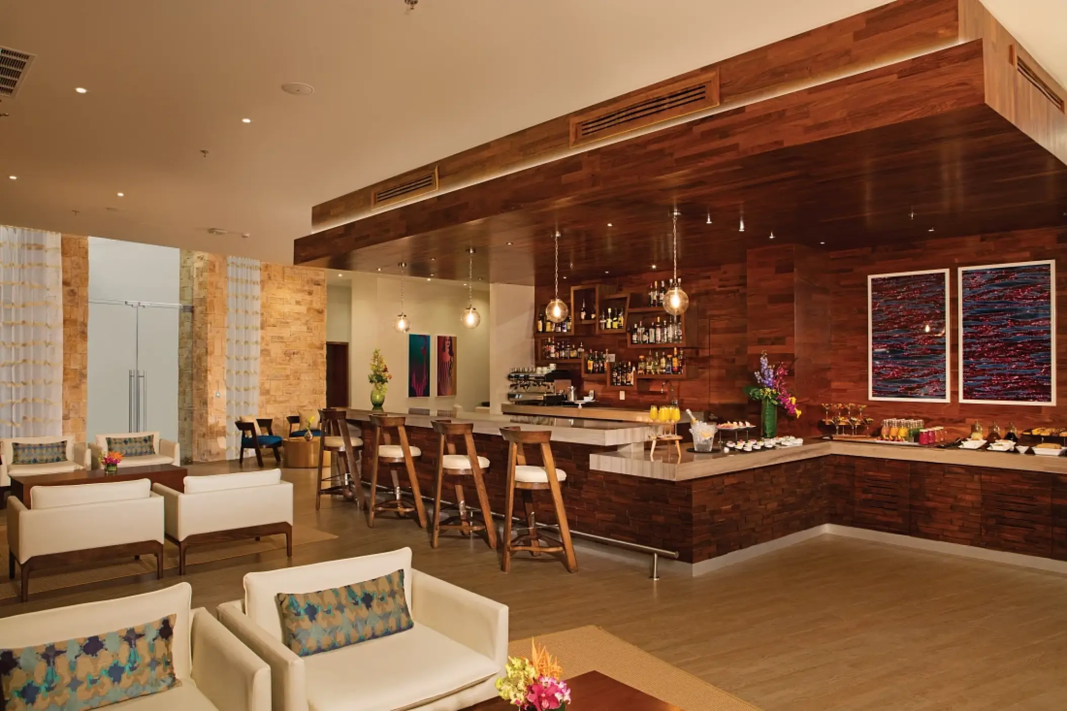 Modern wood-paneled lounge and cocktail bar at Secrets Riviera Cancun, Riviera Maya