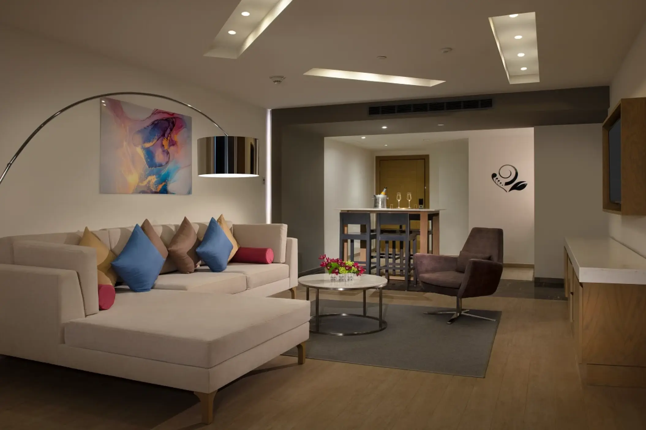 Master suite living area with sectional sofa and dining nook at Secrets Riviera Cancun, Riviera Maya