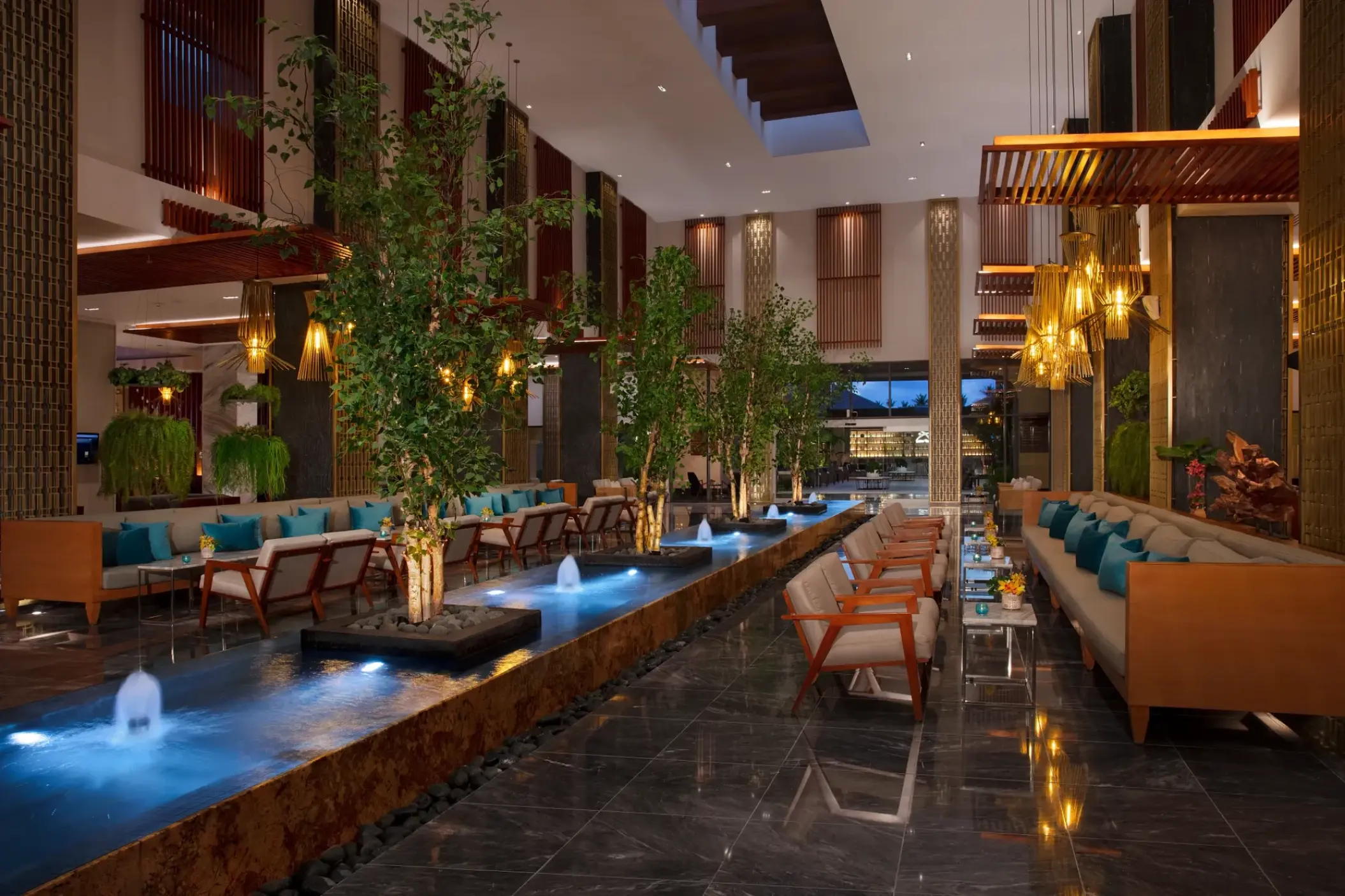 Secrets Royal Beach lobby with water fountains and trees, Punta Cana