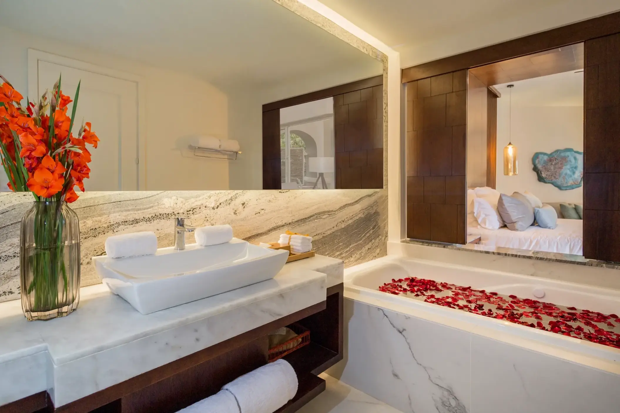 Junior Suite bathroom with a petal-filled soaking tub at Secrets Royal Beach, Punta Cana