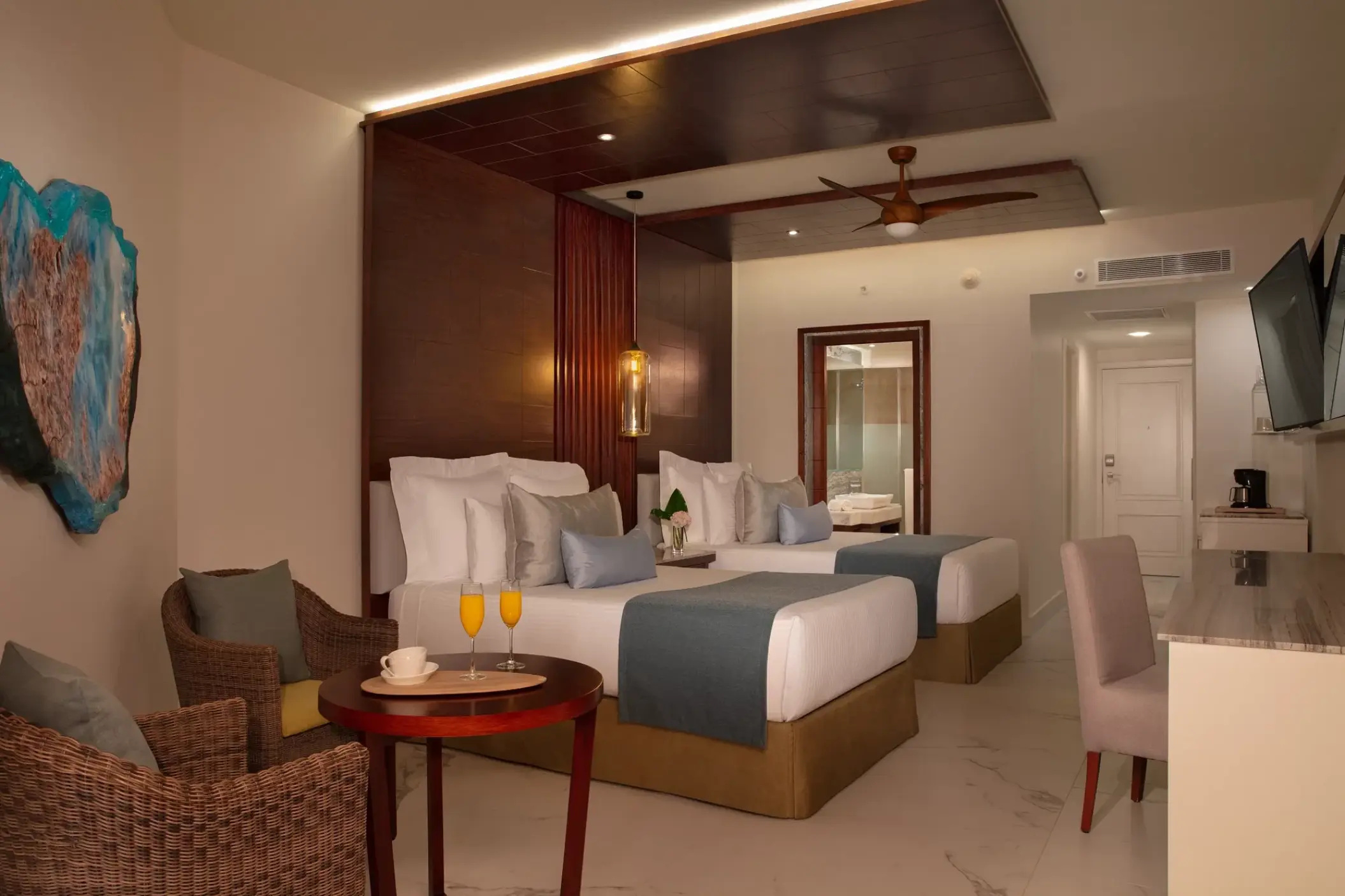 Junior Suite with double beds and a seating area at Secrets Royal Beach, Punta Cana