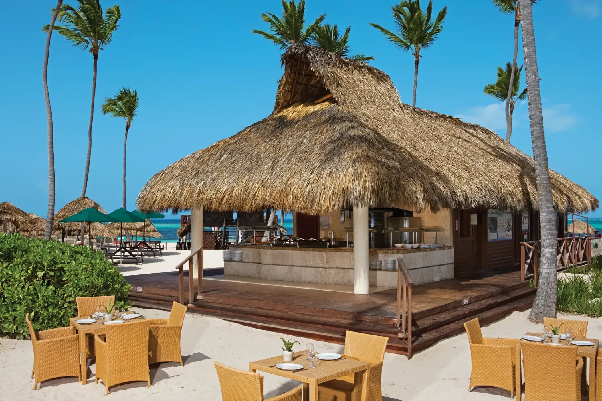 Barefoot Grill with thatched roof and beachfront dining at Secrets Royal Beach, Punta Cana