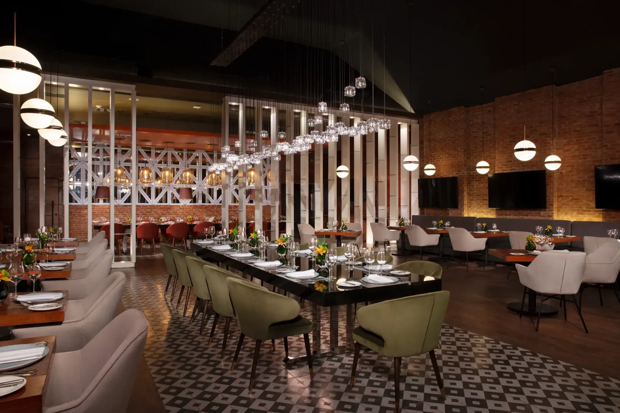 Bluewater Grill dining room with modern pendant lighting at Secrets Royal Beach, Punta Cana
