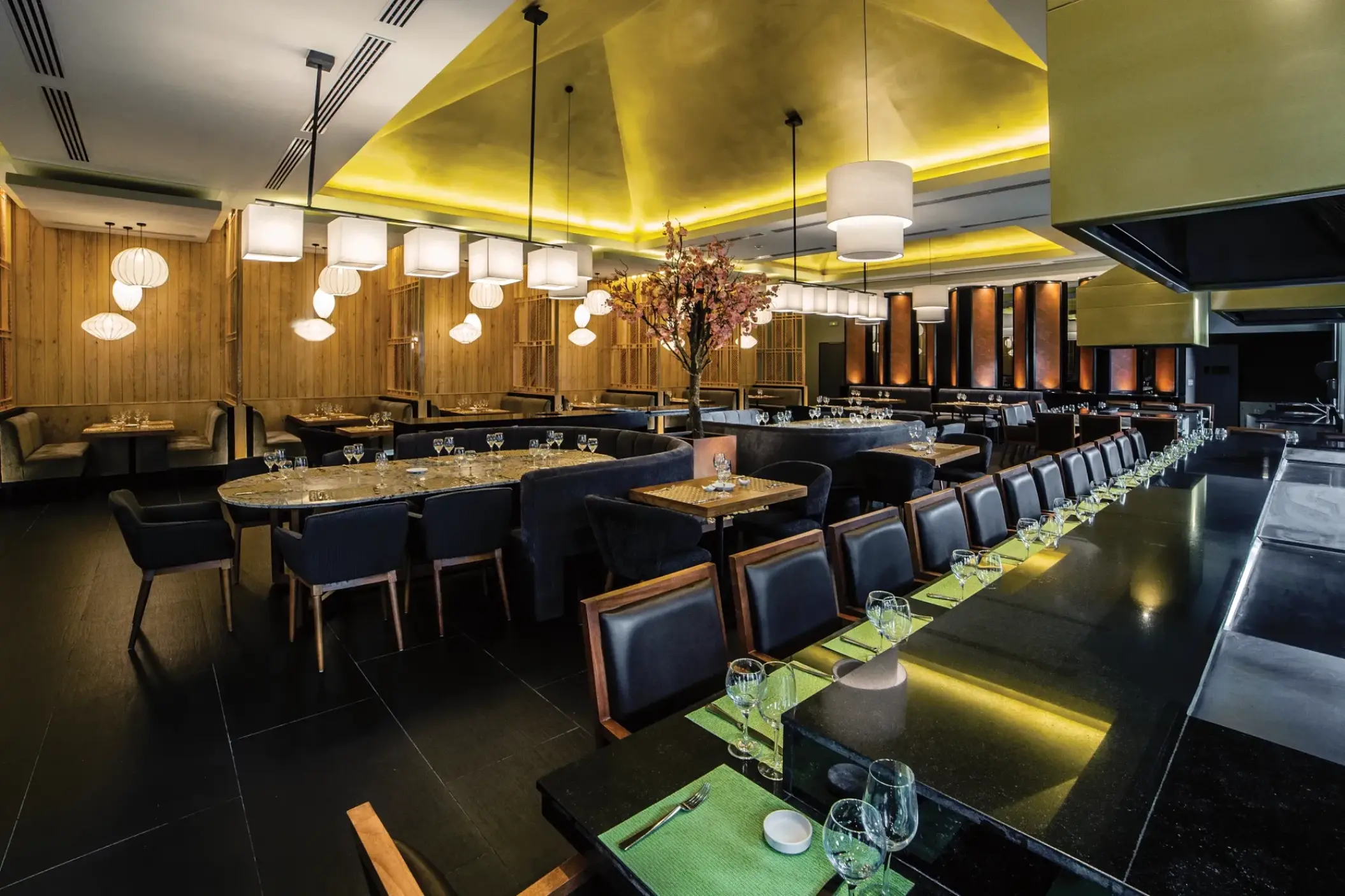 Himitsu restaurant interior with modern lighting and sushi bar at Secrets Royal Beach, Punta Cana