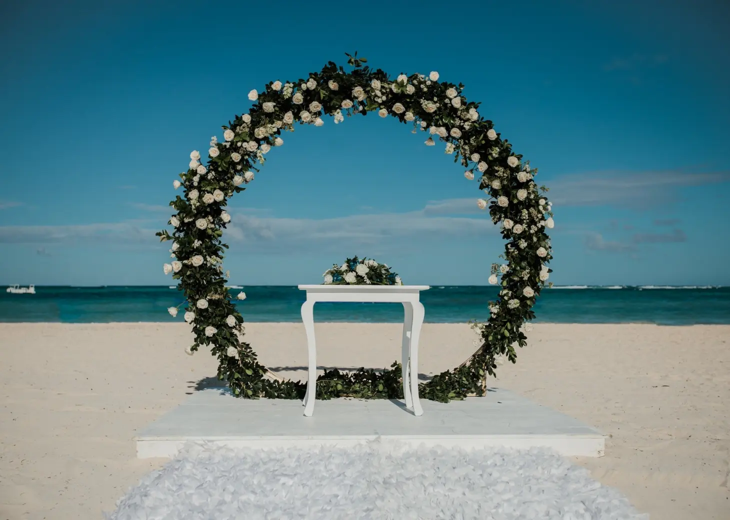 Circular floral arch for a beach ceremony at Secrets Royal Beach, Punta Cana