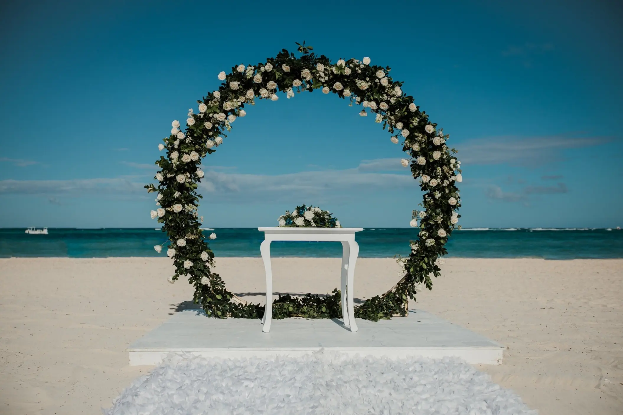 Circular floral arch for a beach ceremony at Secrets Royal Beach, Punta Cana