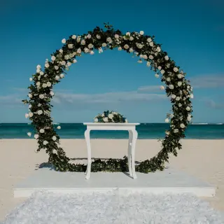 Circular floral arch for a beach ceremony at Secrets Royal Beach, Punta Cana