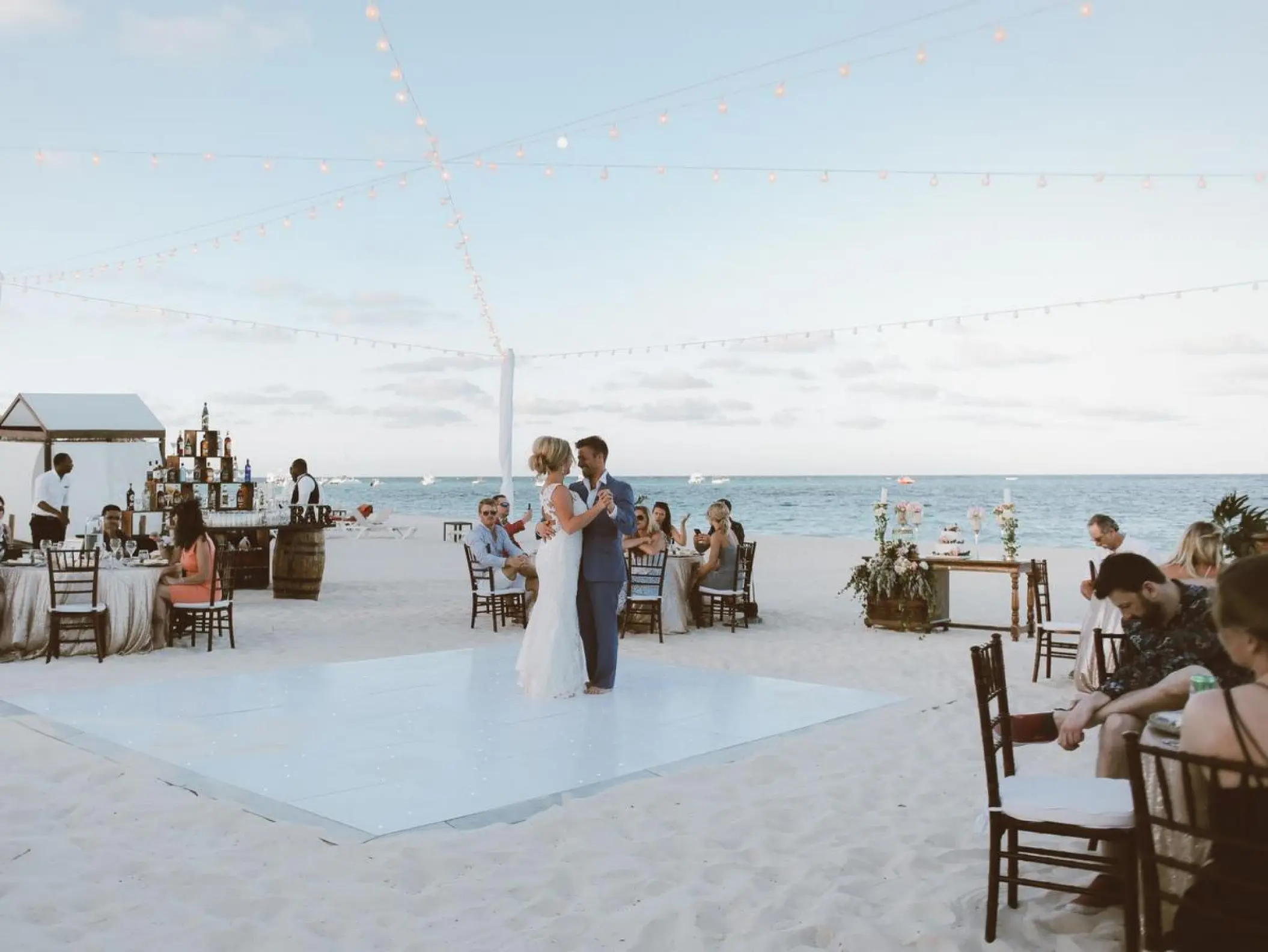 The couple dancing on a beach reception dance floor at Secrets Royal Beach, Punta Cana