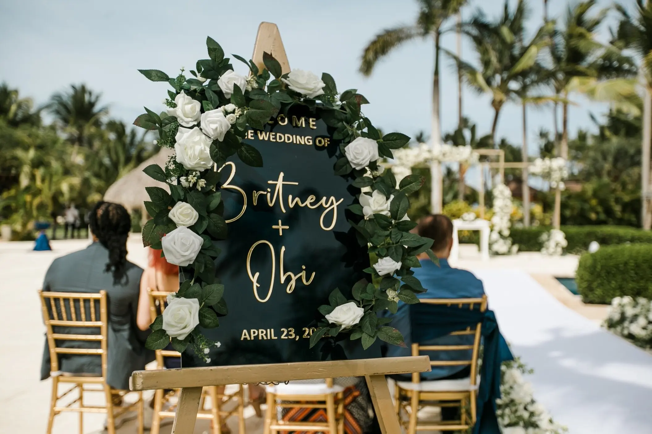 Wedding welcome sign with white roses at Secrets Royal Beach, Punta Cana