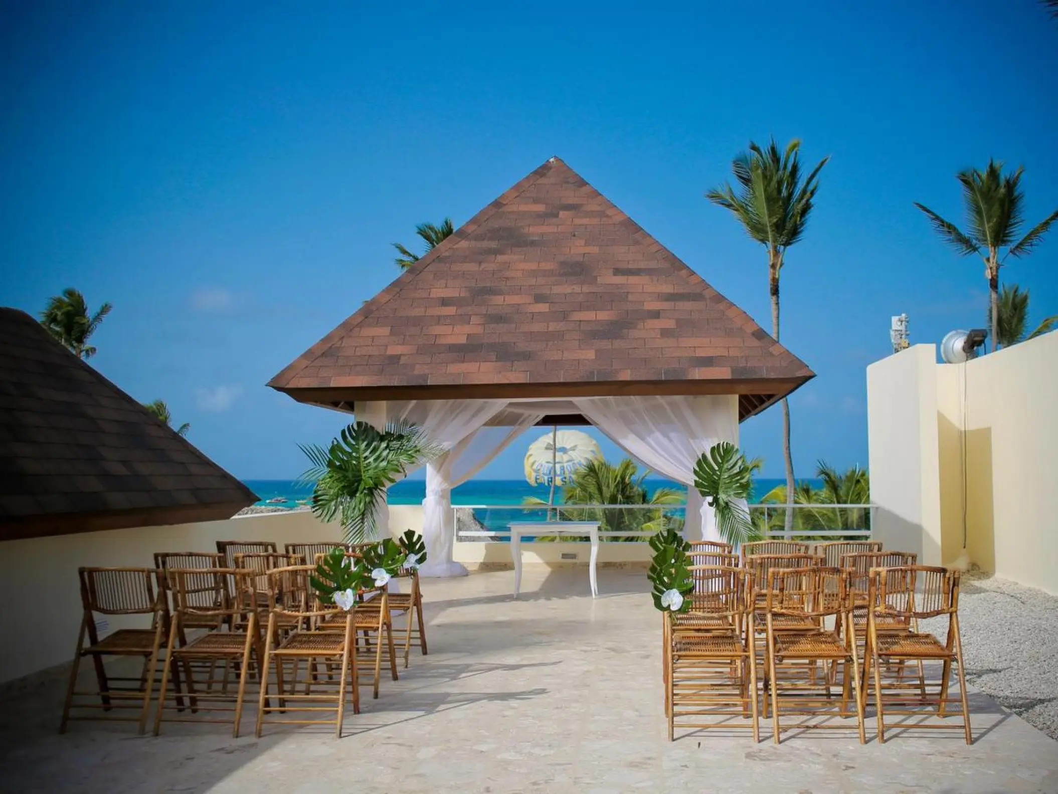 Terrace wedding ceremony under a gazebo at Secrets Royal Beach, Punta Cana