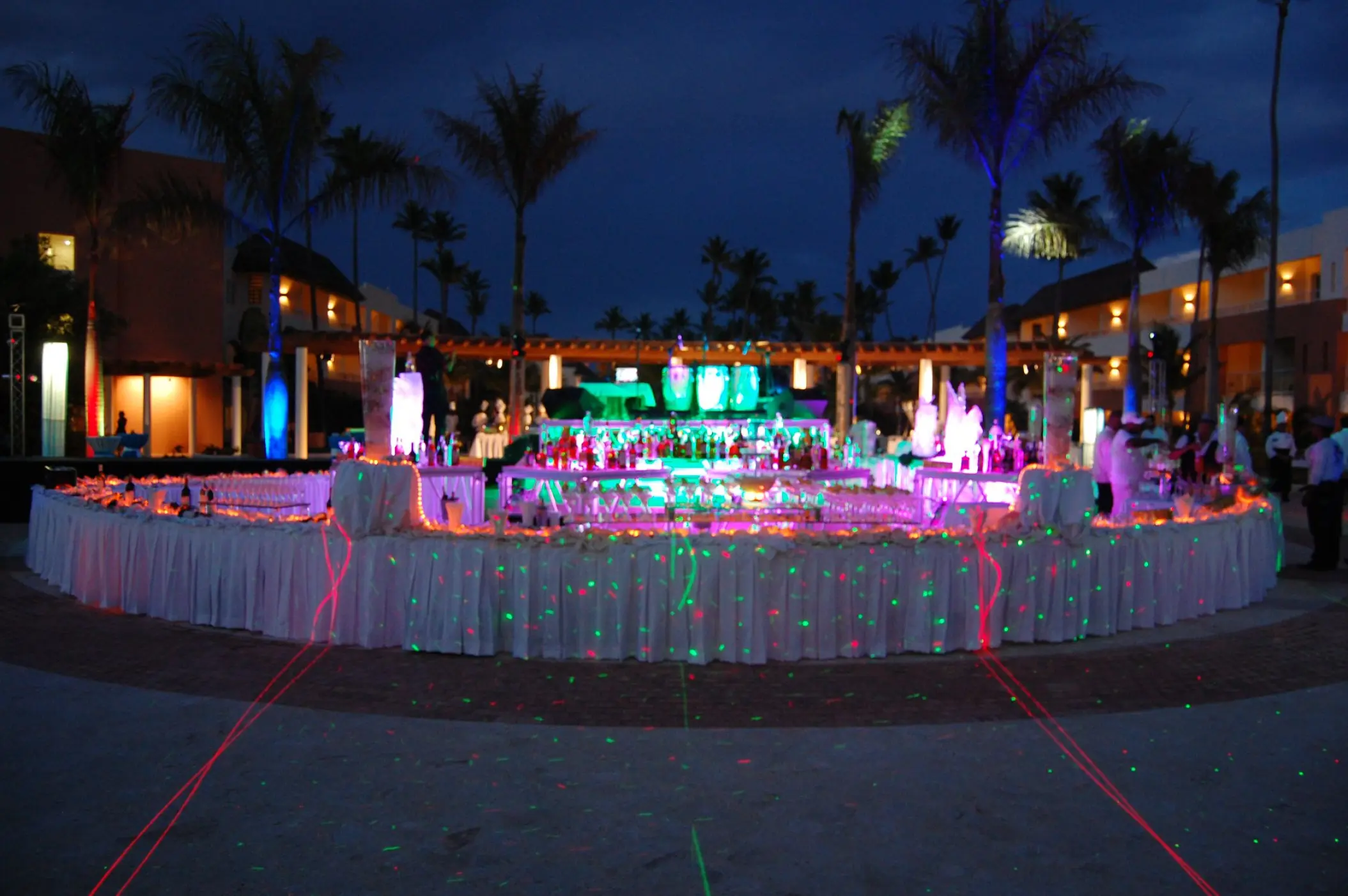 Evening wedding reception buffet with neon lighting at Secrets Royal Beach, Punta Cana