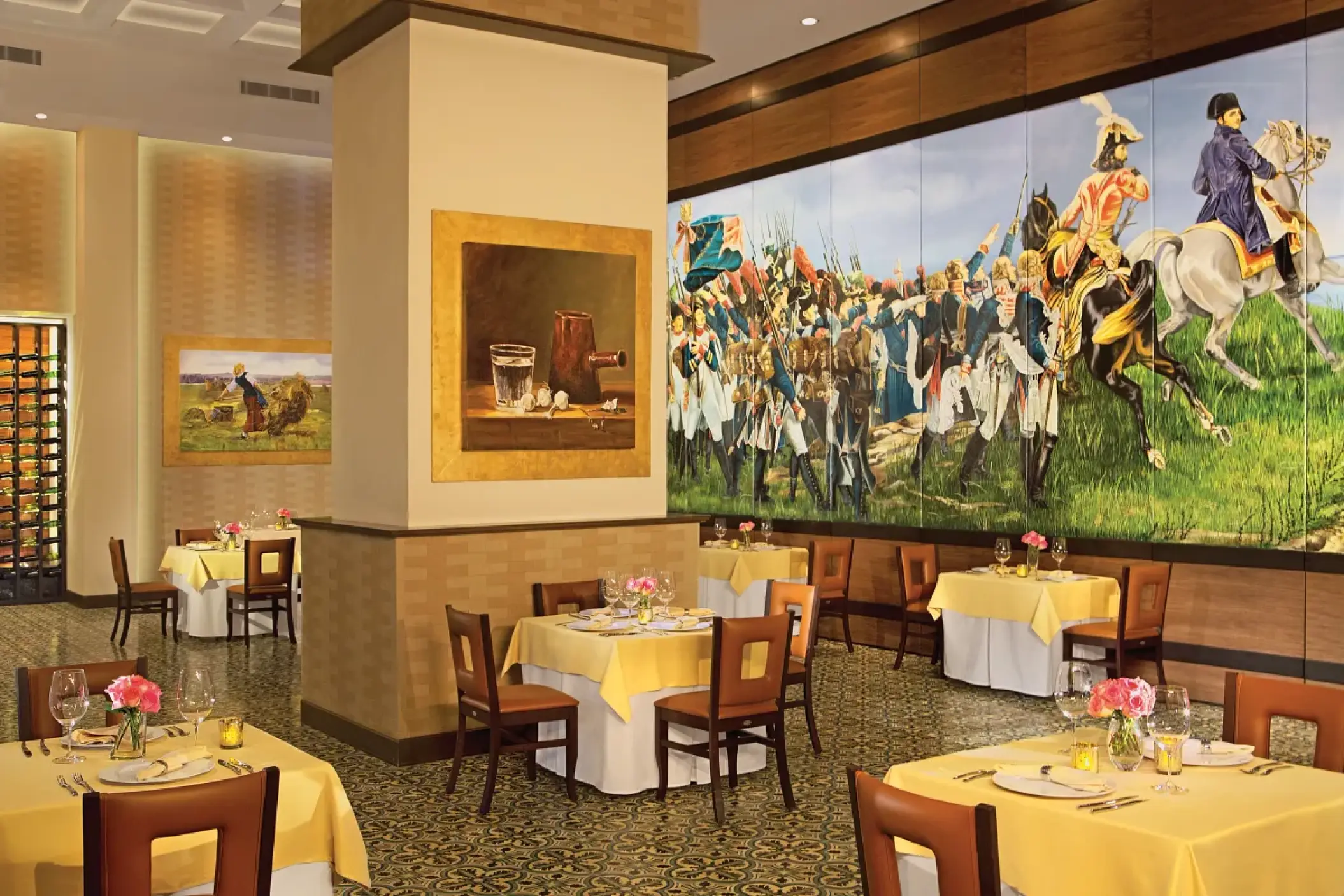 Bordeaux restaurant dining room with large murals and set tables at Secrets Vallarta Bay, Puerto Vallarta