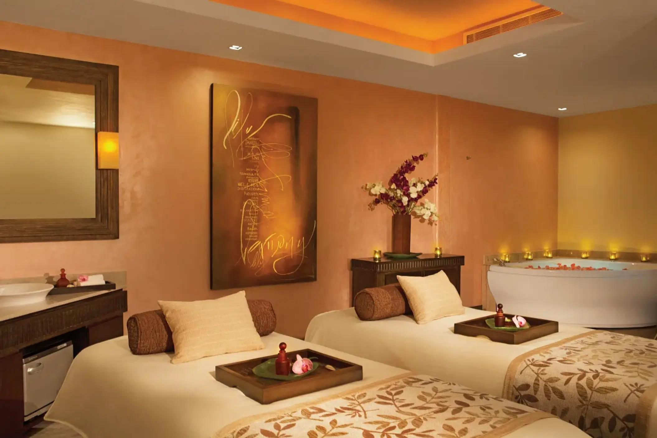Couples massage room with two treatment beds and a hydrotherapy tub at Secrets Vallarta Bay, Puerto Vallarta