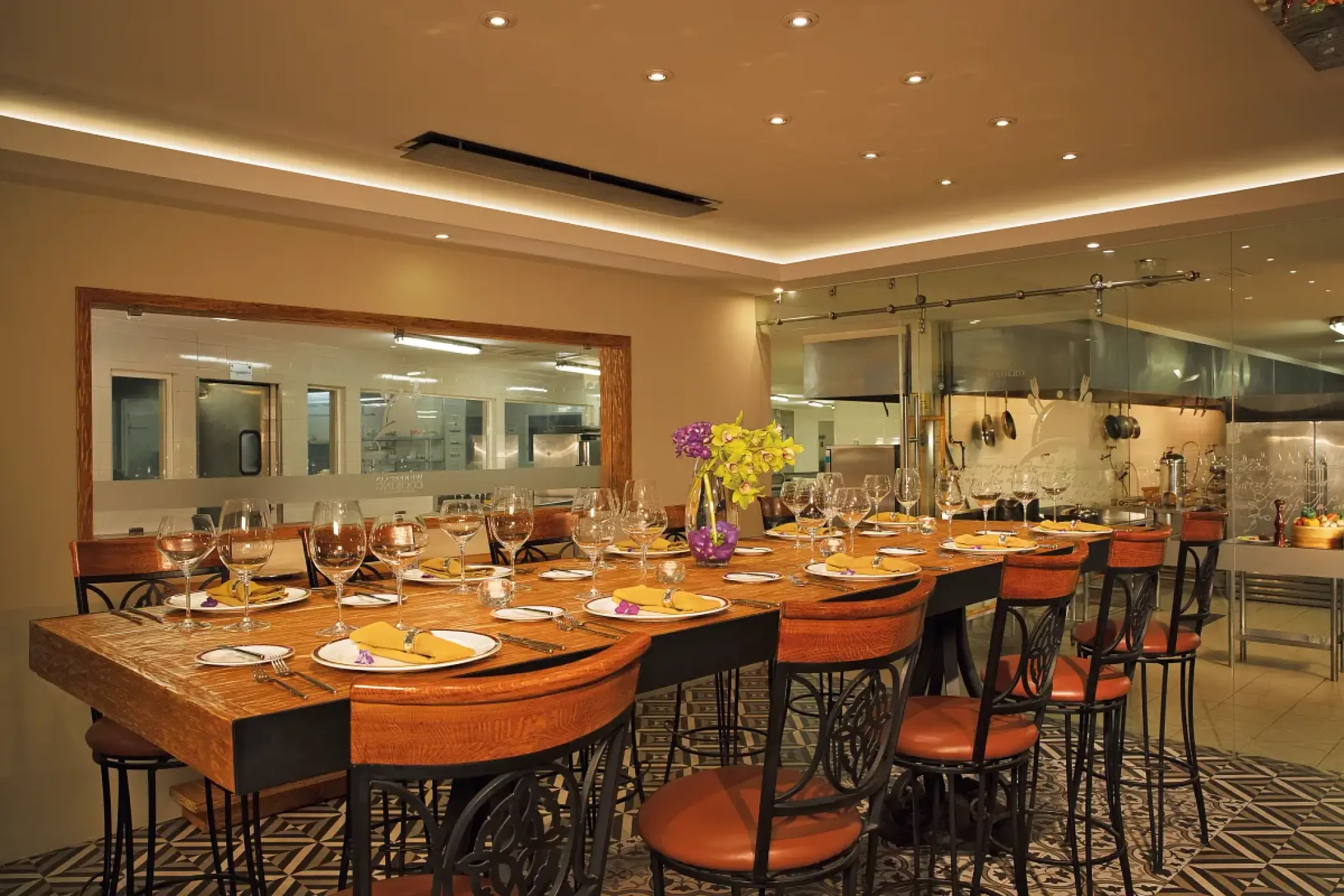 Chef's table dining setup with high chairs and place settings at Secrets Vallarta Bay, Puerto Vallarta