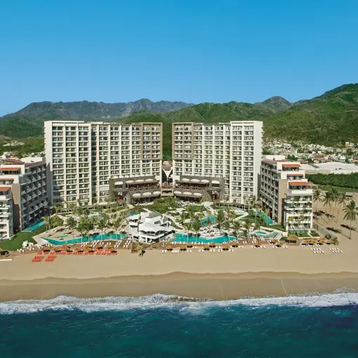 Aerial view of Secrets Vallarta Bay beachfront exterior and pools, Puerto Vallarta