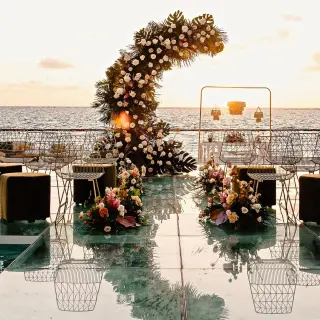 Acrylic aisle and floral moon arch wedding ceremony at Sensira Resort, Riviera Maya
