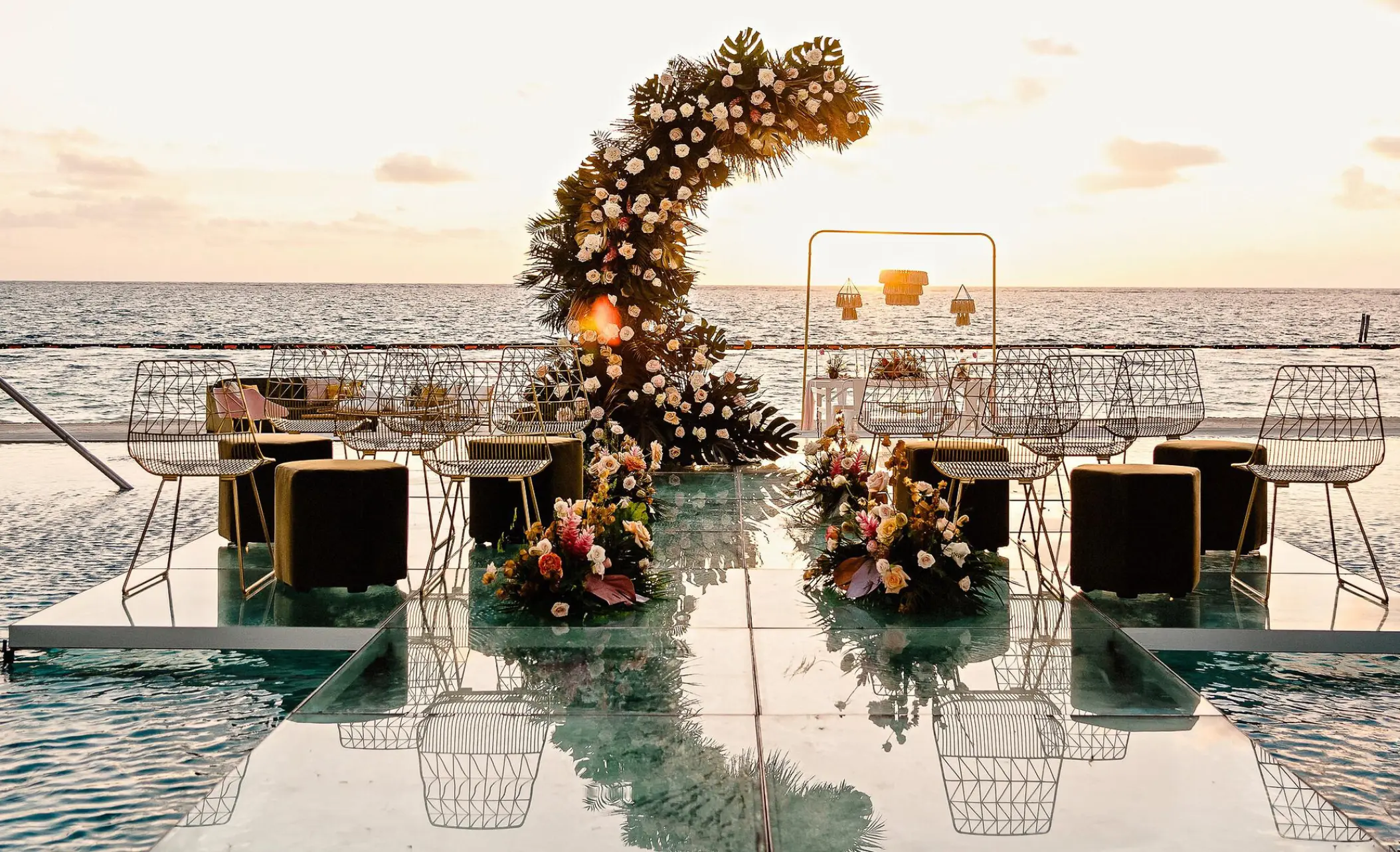 Acrylic aisle and floral moon arch wedding ceremony at Sensira Resort, Riviera Maya