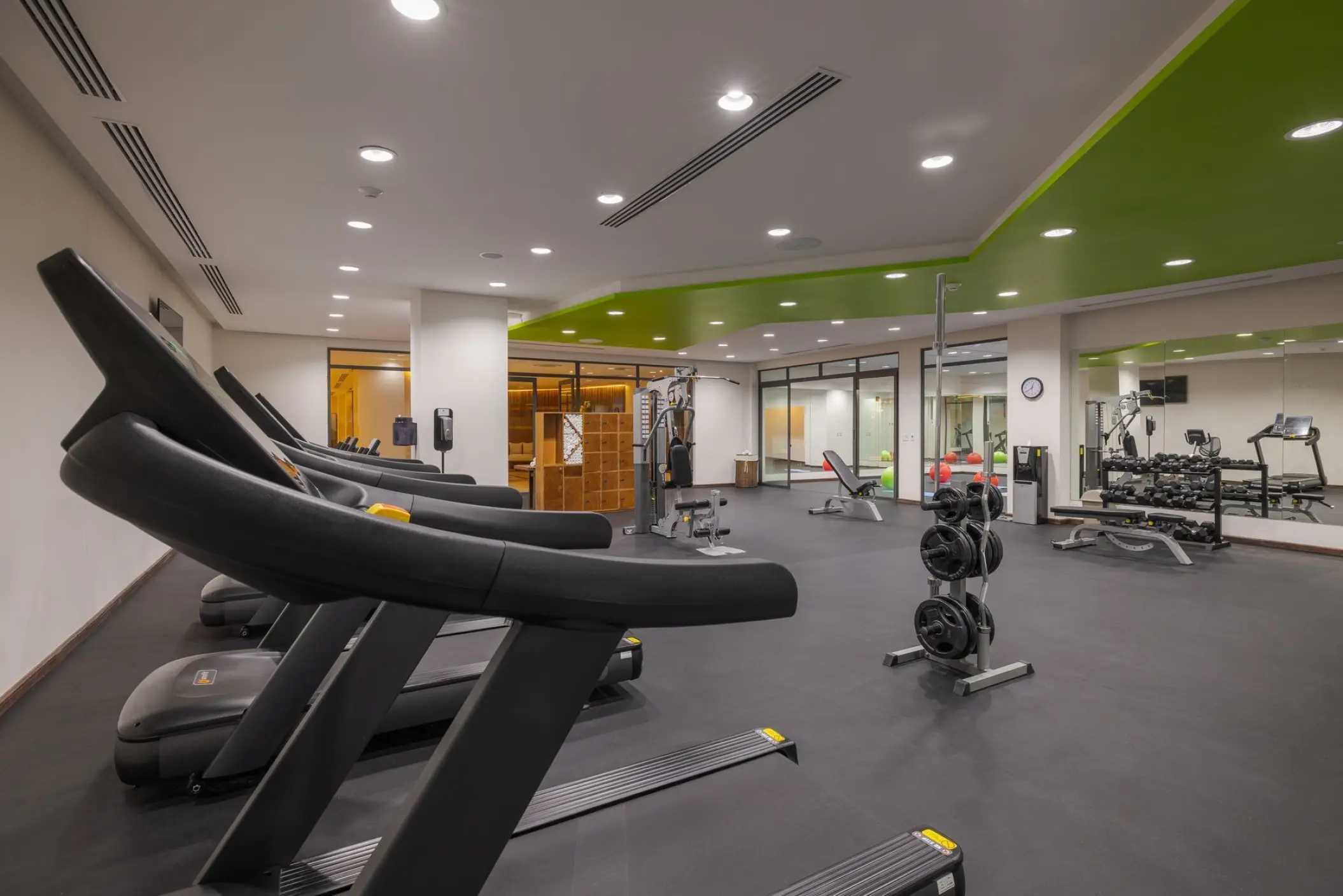 Fitness center with treadmills and weight equipment at Sensira Resort, Riviera Maya