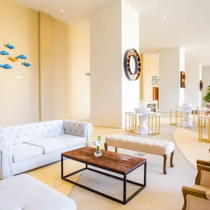 Modern lounge area and cocktail reception setup at Sensira Resort, Riviera Maya
