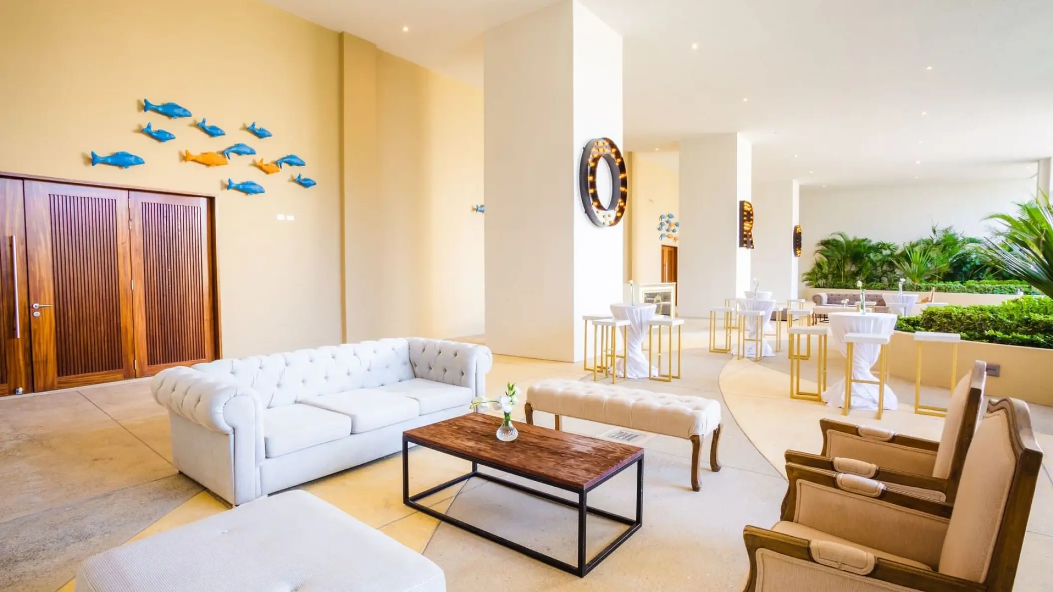 Modern lounge area and cocktail reception setup at Sensira Resort, Riviera Maya