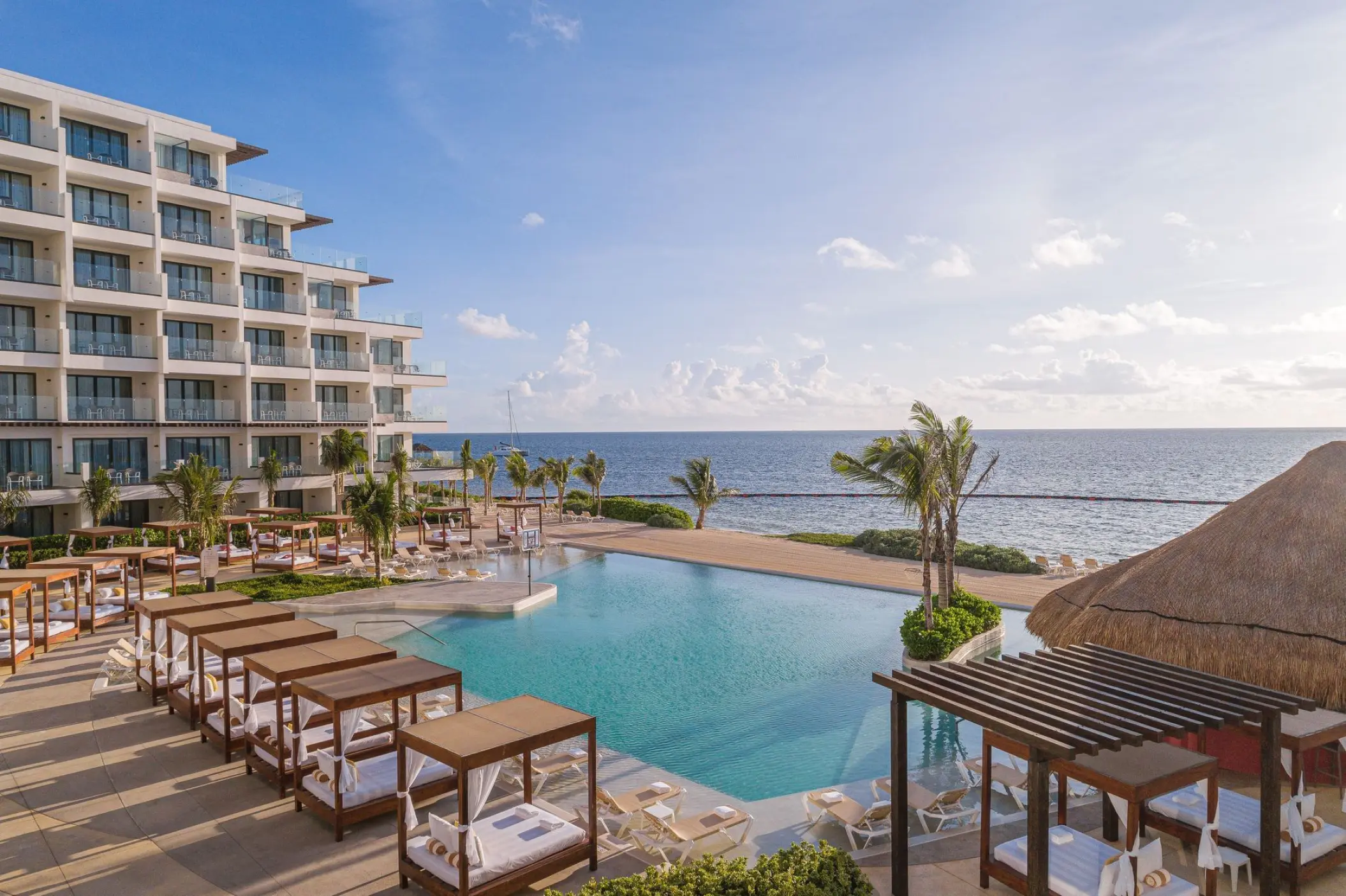 Sensira Riviera Maya infinity pool with ocean view and poolside cabanas, Riviera Maya