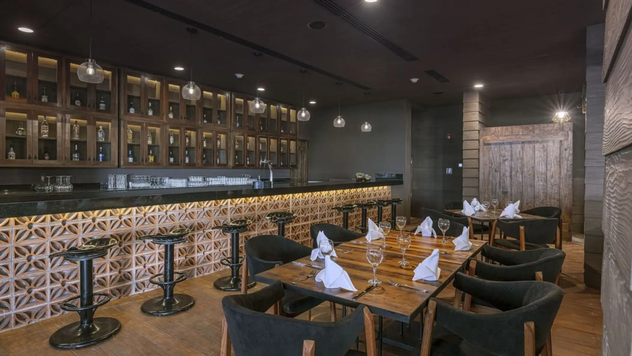 Rodeo Grill restaurant bar and dining tables at Sensira Riviera Maya