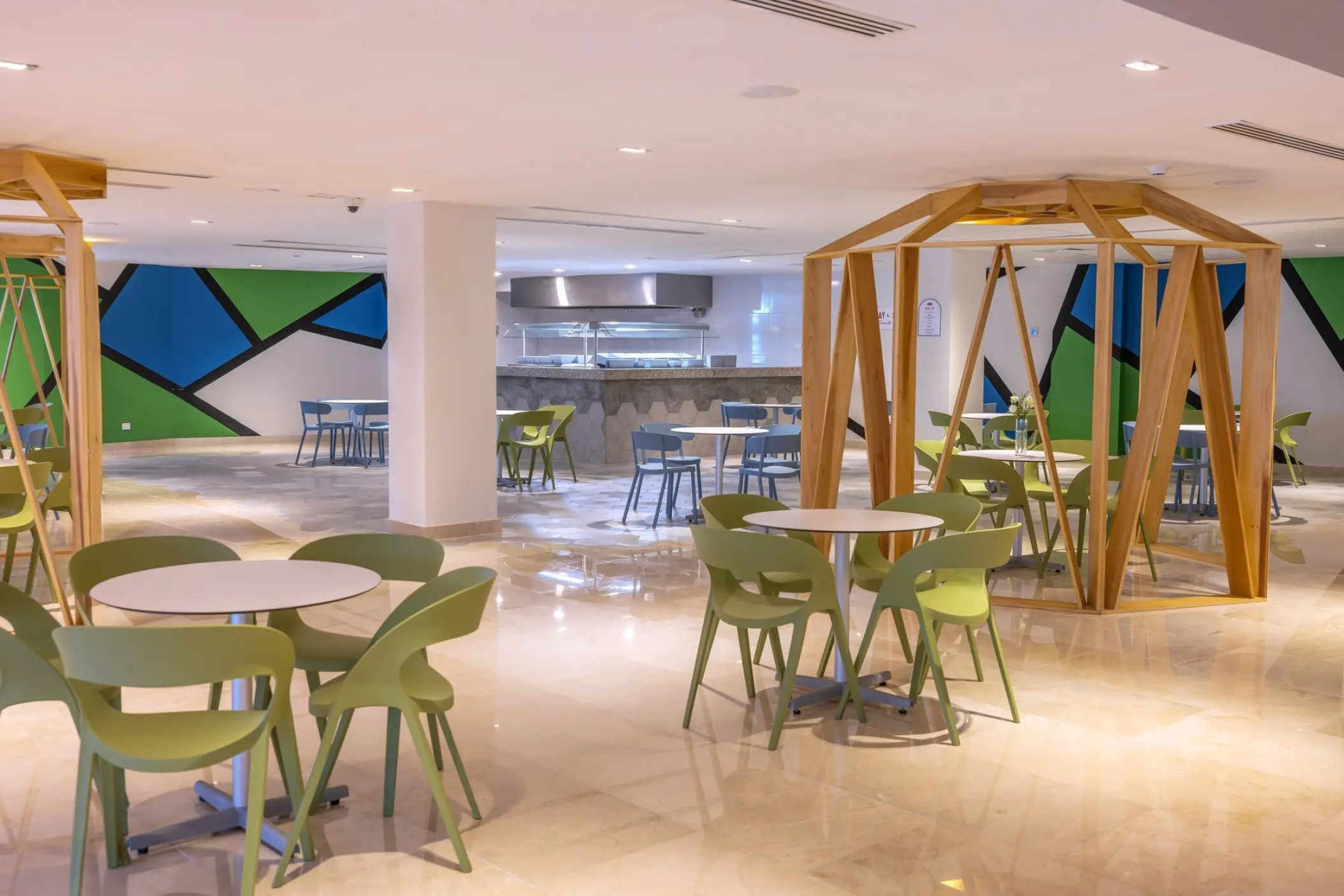 Indoor snack bar and colorful dining area at Sensira Riviera Maya
