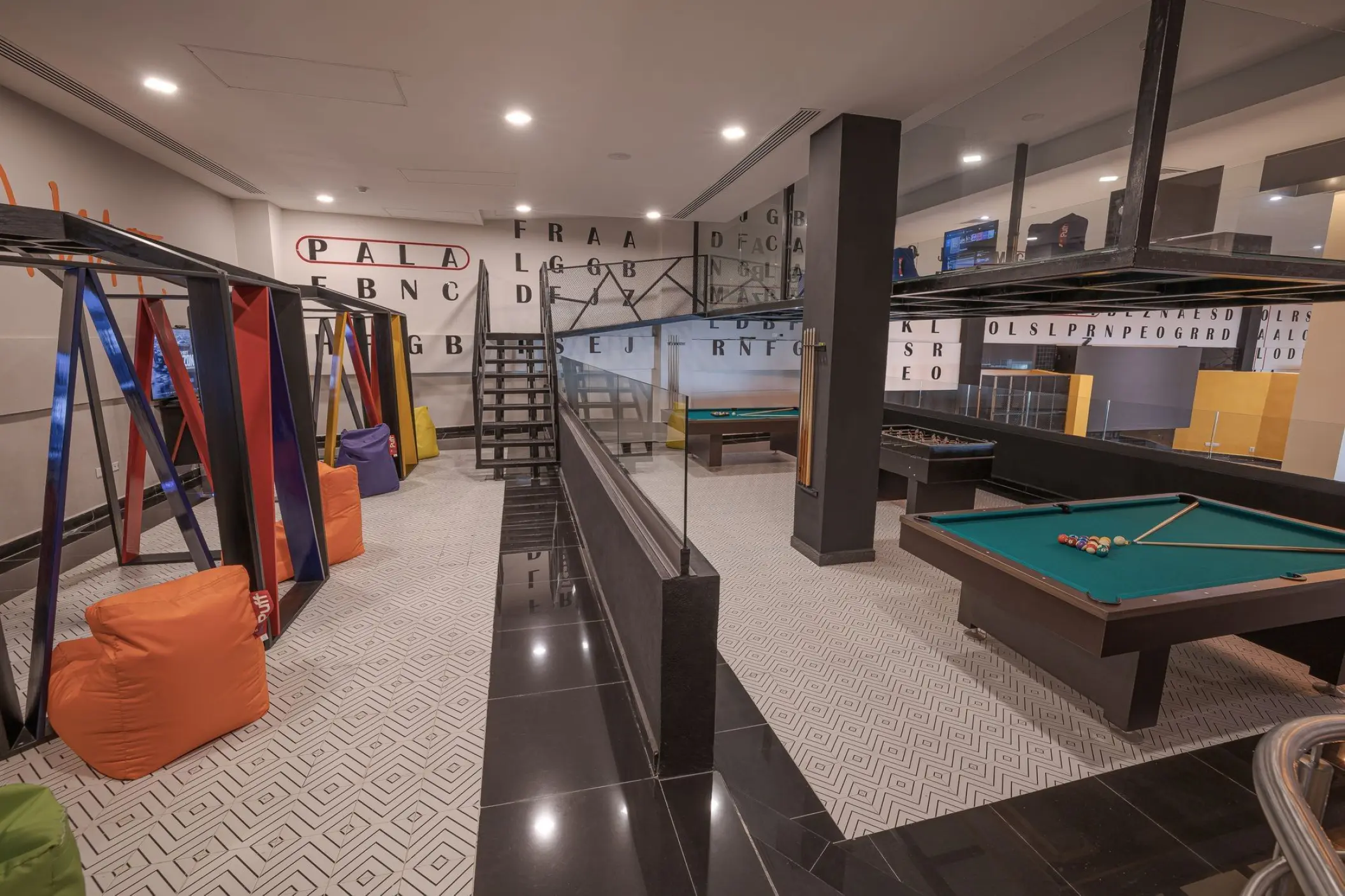 Teens club with pool tables and bean bag chairs at Sensira Riviera Maya