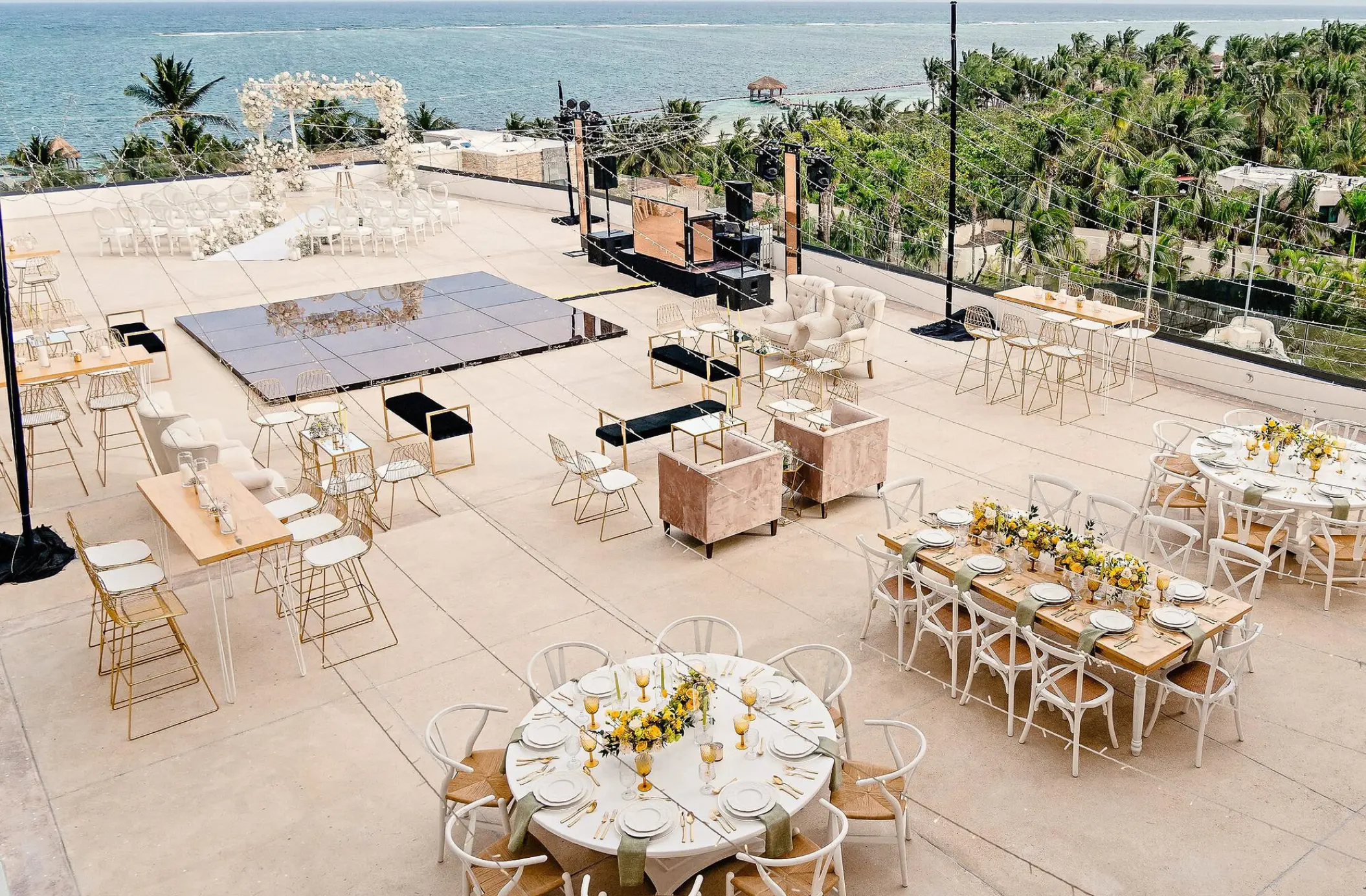 Rooftop terrace wedding reception setup with dance floor at Sensira Resort, Riviera Maya