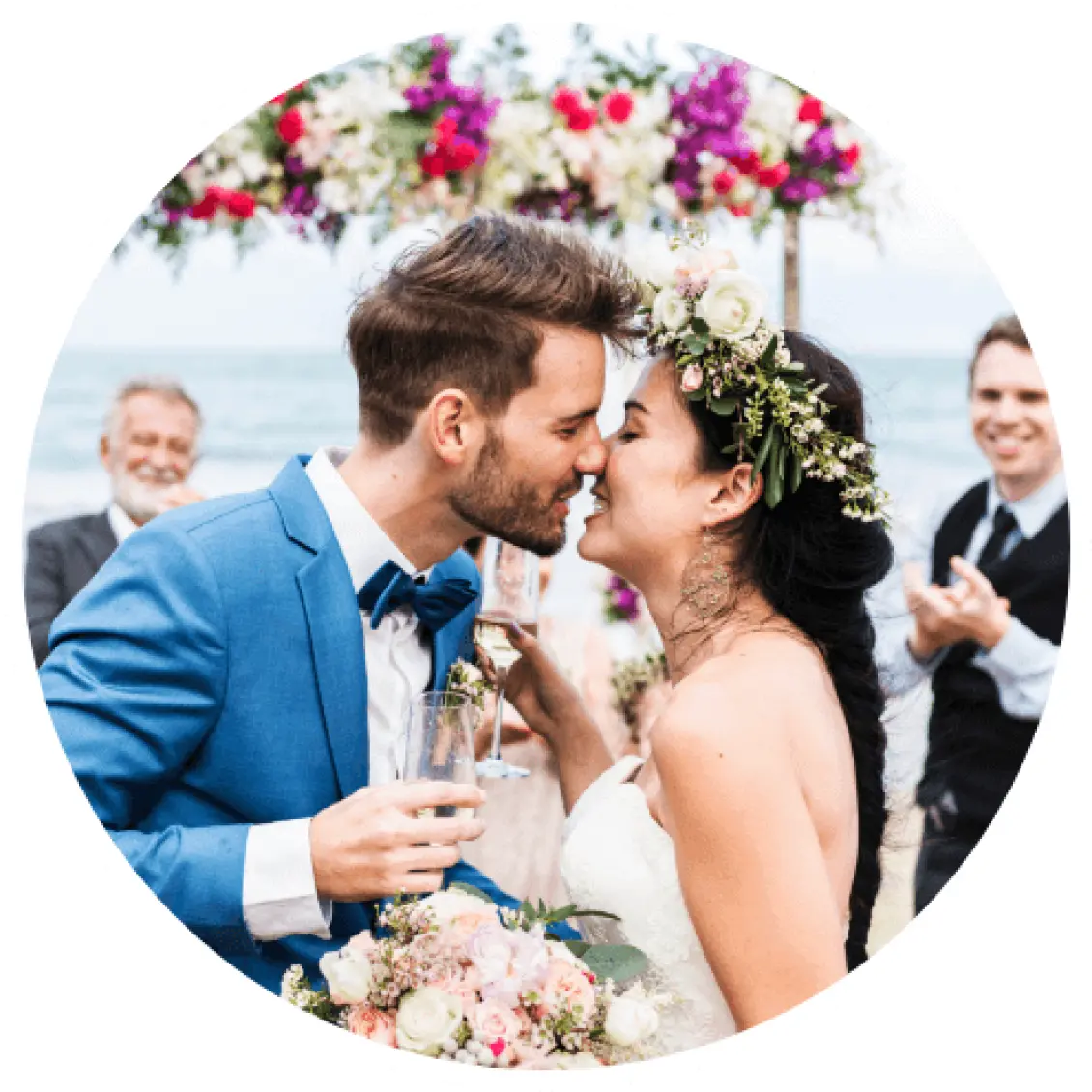 Bride and groom about to kiss during a beach wedding ceremony