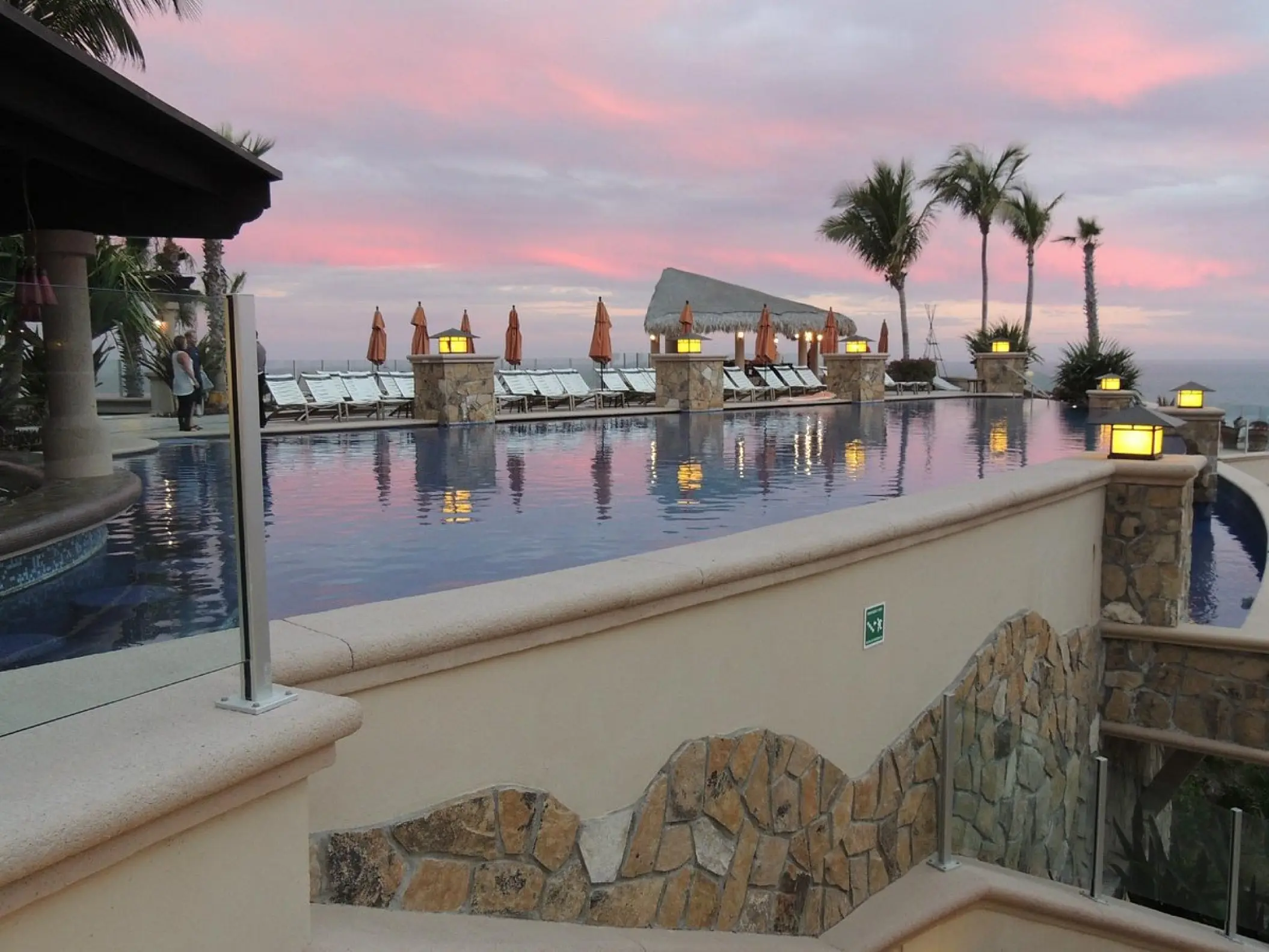 Infinity pool and lanterns at sunset at Hyatt Vacation Club at Sirena del Mar, Cabo San Lucas
