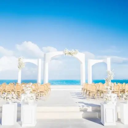 Sky wedding ceremony terrace with white arches at Majestic Mirage Costa Mujeres, Cancun
