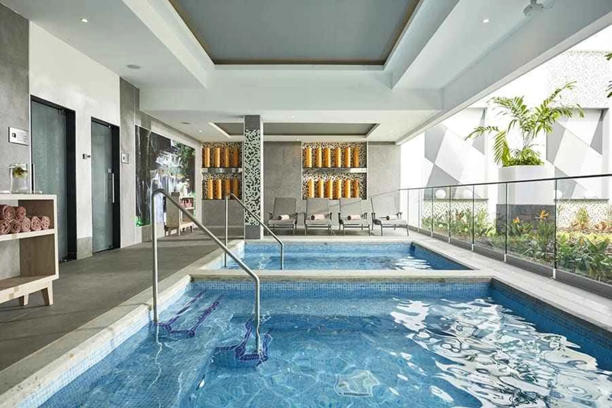 Indoor hydrotherapy pools and lounge chairs at Renova Spa, Riu Palace Riviera Maya