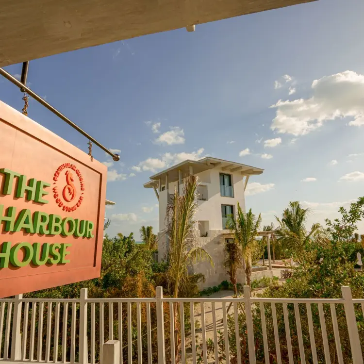 The Harbour House sign and white suite buildings at St. Somewhere Resort, Isla Holbox