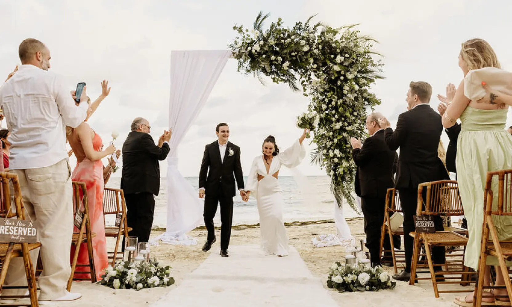 Alyssa & Ryan walking back down the aisle at Dreams Natura, Riviera Maya