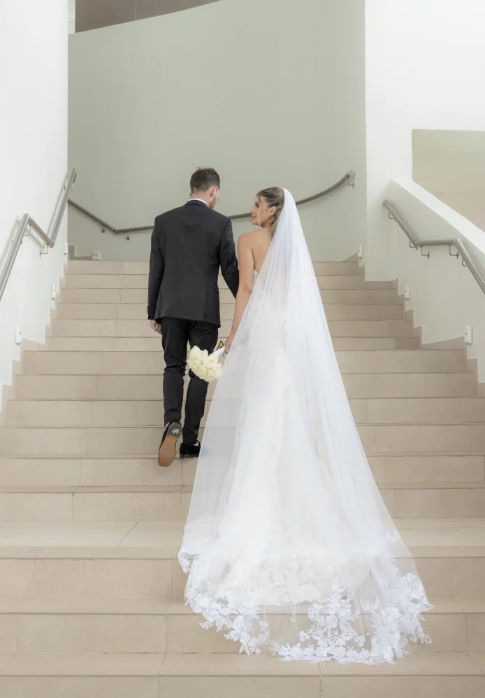 Andreana and Alessandro walk up the stairs