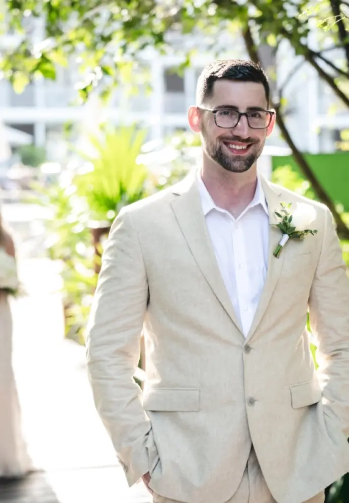Danielle and Derrek’s first look wedding moment on a tropical walkway