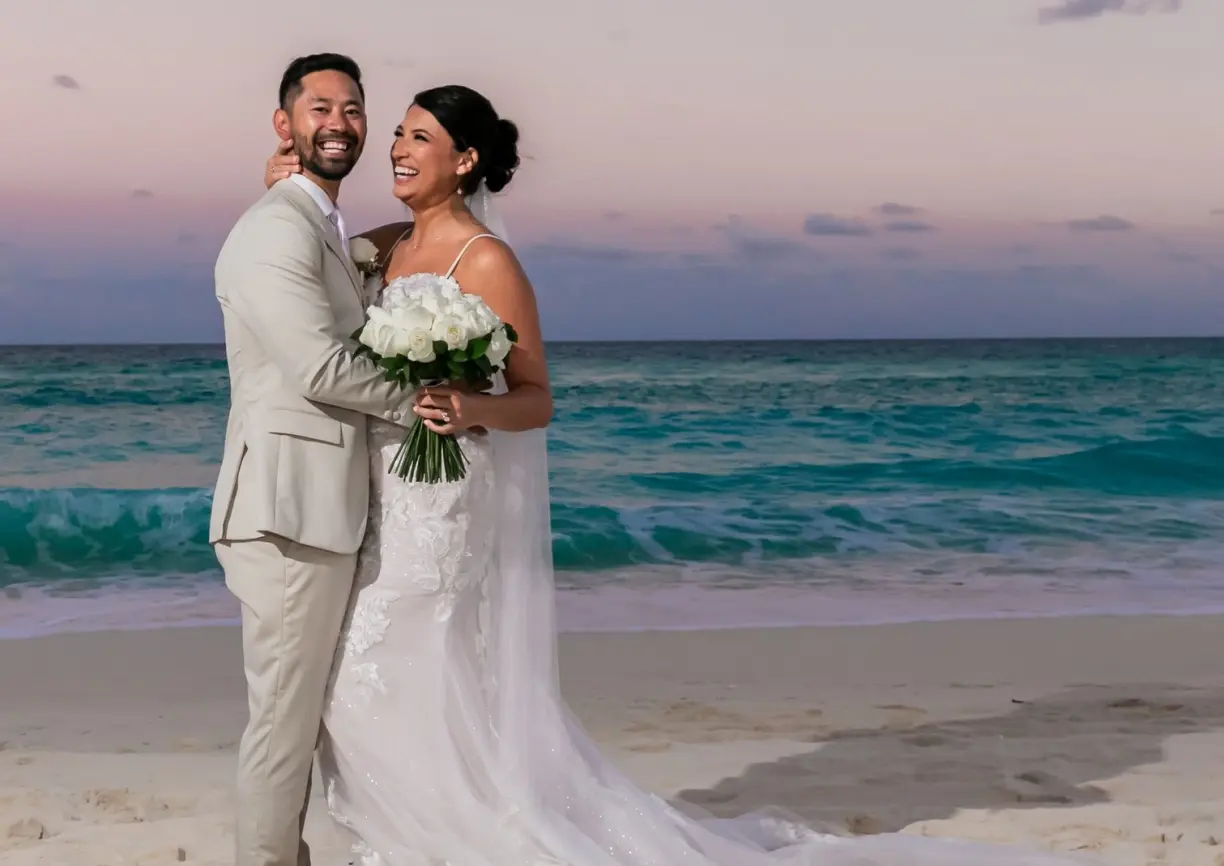 Danielle & Junya's sunset wedding portrait on the beach at Paradisus Cancun