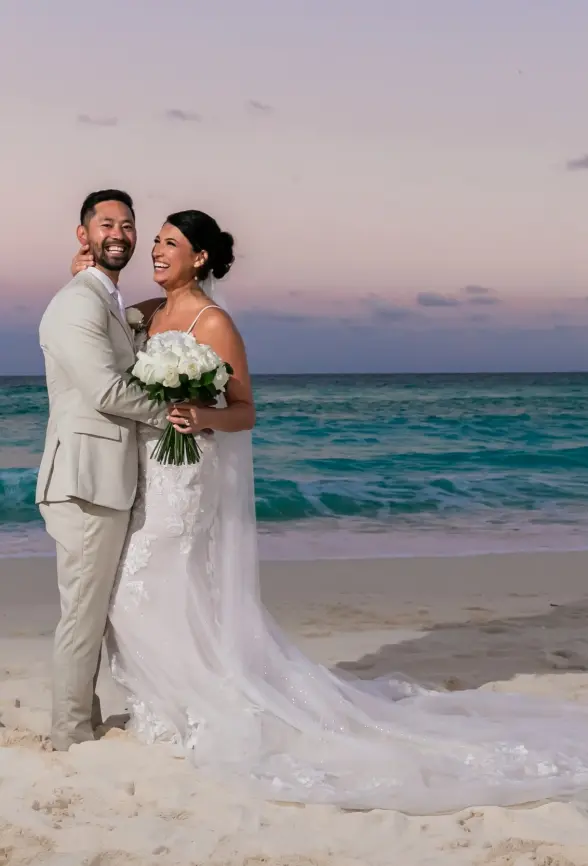 Danielle & Junya's sunset wedding portrait on the beach at Paradisus Cancun